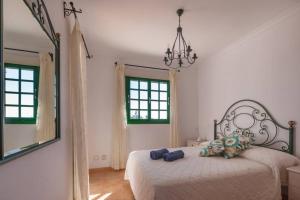 Ένα ή περισσότερα κρεβάτια σε δωμάτιο στο Dúplex con jardín y buenas vistas
