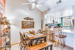 a kitchen with a dining room table and chairs at Aspenwood 4259 in Pagosa Springs