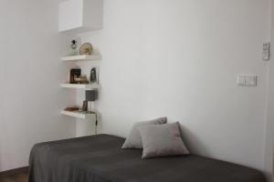 Uma cama ou camas num quarto em Casas d'Almofala