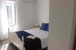Uma cama ou camas num quarto em Casas d'Almofala