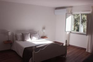 Uma cama ou camas num quarto em Casas d'Almofala
