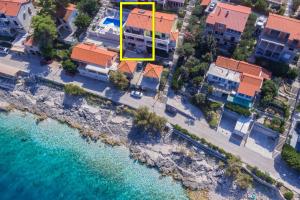 an aerial view of a building next to the water at Apartments Andrijic in Prigradica