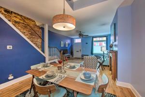 a dining room with blue walls and a table and chairs at Harrisburg Retreat with Deck, Balcony and Grill! in Harrisburg