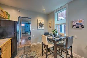 a kitchen and dining room with a table and a refrigerator at Harrisburg Retreat with Deck, Balcony and Grill! in Harrisburg