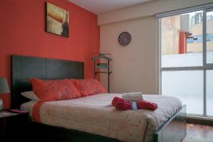 מיטה או מיטות בחדר ב-Luxstone Executive & Suites