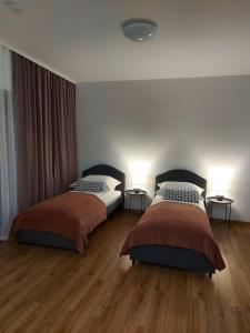 Postel nebo postele na pokoji v ubytování Apartamenty Lawendowy Zakątek 5