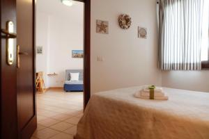 Postel nebo postele na pokoji v ubytování Il Melo Residence