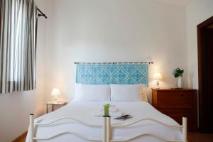 Postel nebo postele na pokoji v ubytování Il Melo Residence