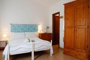 Postel nebo postele na pokoji v ubytování Il Melo Residence
