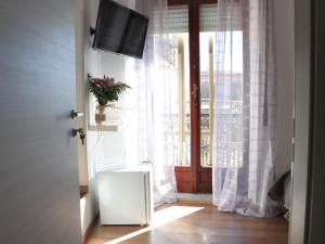 TV a/nebo společenská místnost v ubytování B&B Carlo V