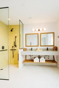 a bathroom with a sink and a shower at The Rockaway Hotel in Queens