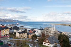 a city with a harbor and a body of water at Temporales Ushuaia - Bahia loft in Ushuaia