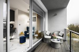 Posedenie v ubytovaní Apartament Zacisze z prywatną sauną