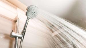 a shower with water shooting out of it at M Star Hotel Cleveland in Cleveland +26 photos