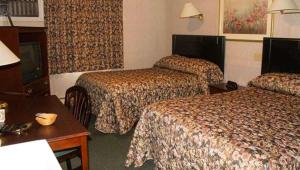 Postel nebo postele na pokoji v ubytování Traveller's Inn Prince Edward Island