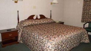 Postel nebo postele na pokoji v ubytování Traveller's Inn Prince Edward Island