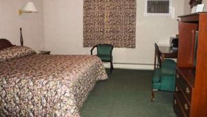 Postel nebo postele na pokoji v ubytování Traveller's Inn Prince Edward Island