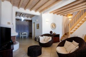 A seating area at Natural Stone Villas