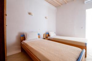 A bed or beds in a room at Natural Stone Villas