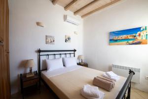 A bed or beds in a room at Natural Stone Villas