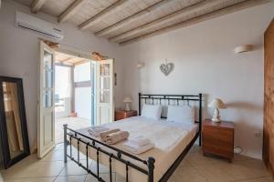 A bed or beds in a room at Natural Stone Villas
