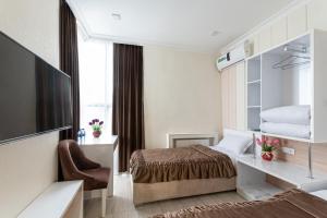 TV a/nebo společenská místnost v ubytování Tantana Hotel