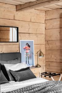 Postel nebo postele na pokoji v ubytování APARTAMENTY DVOOR1924
