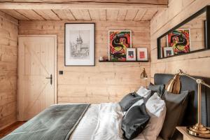 Postel nebo postele na pokoji v ubytování APARTAMENTY DVOOR1924