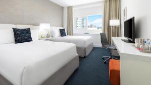 Ein Bett oder Betten in einem Zimmer der Unterkunft YVE Hotel Miami