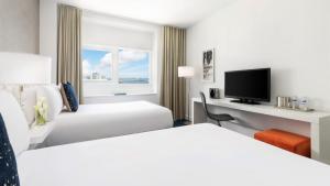 Ein Bett oder Betten in einem Zimmer der Unterkunft YVE Hotel Miami