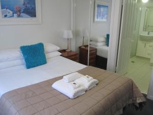 Postelja oz. postelje v sobi nastanitve Costa D'Ora Holiday Apartments
