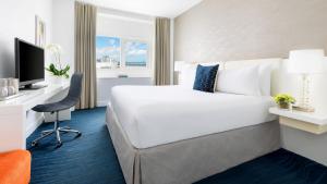 Ein Bett oder Betten in einem Zimmer der Unterkunft YVE Hotel Miami