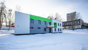 a building in the snow in a city at Penzion Start Ostrava in Ostrava
