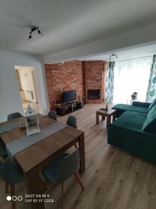 Posedenie v ubytovaní Apartamenty Pod Sosnami Ostróda Międzylesie 6os