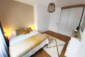 Кровать или кровати в номере Le S&L - Hyper Centre