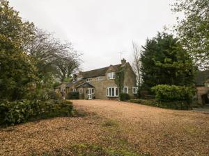 a large house with a large yard in front of it at The Old Barn in Alton