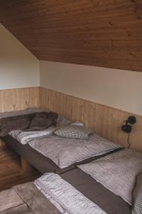 Posteľ alebo postele v izbe v ubytovaní Chata trojka