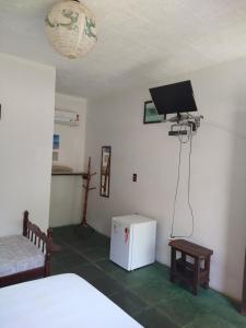 TV a/nebo společenská místnost v ubytování Araribé Pousada