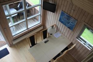 an overhead view of a table in a tiny house at Læsø Camping & Hytteby in Vesterø Havn