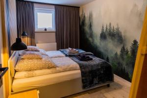 Posteľ alebo postele v izbe v ubytovaní Apartament Salamandra