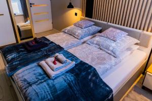 Posteľ alebo postele v izbe v ubytovaní Apartament Salamandra