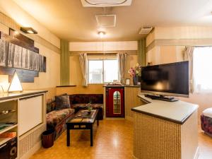 Kuchyň nebo kuchyňský kout v ubytování Tabist Hotel Nizi Fuefuki Misaka