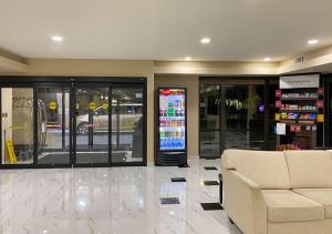 a store lobby with a couch and a store at Comfort Suites Kings Bay Naval Base Area in Kingsland