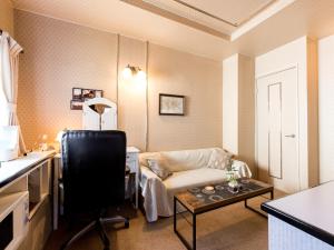 Postel nebo postele na pokoji v ubytování Tabist Hotel Nizi Fuefuki Misaka