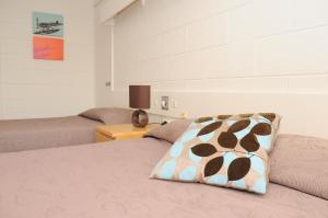 Postel nebo postele na pokoji v ubytování Peninsula Motor Inn