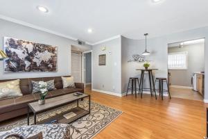 a living room with a couch and a table at The Best Midtown Location by Piedmont Park in Atlanta