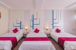 Postel nebo postele na pokoji v ubytování Vy Anh Đà Lạt Hotel