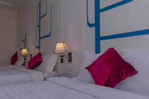 Postel nebo postele na pokoji v ubytování Vy Anh Đà Lạt Hotel