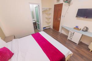 Postel nebo postele na pokoji v ubytování Vy Anh Đà Lạt Hotel