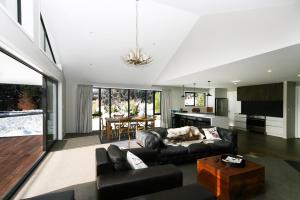 a living room with a couch and a table at Lake Views at Antler Lodge in Lake Tekapo